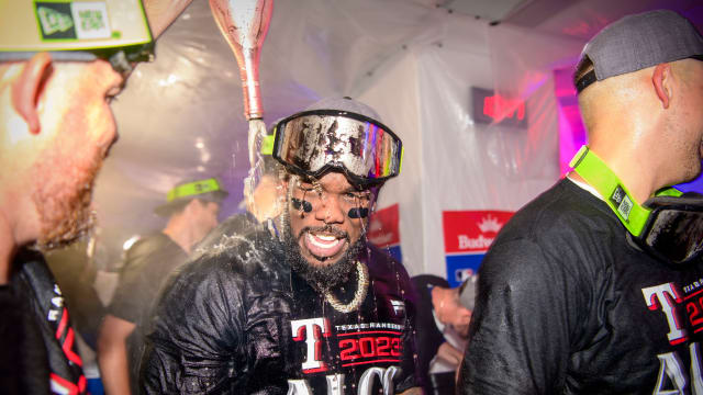 The Texas Rangers and Adolis Garcia, center, celebrate after sweeping the Baltimore Orioles in Game 3 of the ALDS Tuesday night at Globe Life Field.